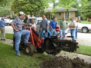 the Irving team trenches out a new sprinkler line